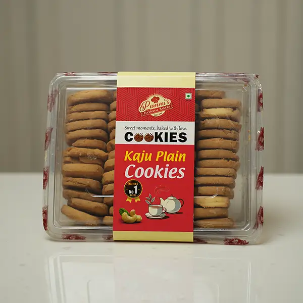 "Golden brown Kaju Plain Cookies topped with roasted cashews – Pammi’s Bakers special."