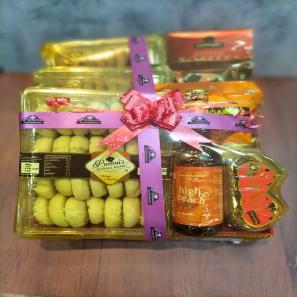 Pammi’s Bakers premium gift hamper with cakes, cookies, sweets, chocolates, and dry fruits beautifully arranged for festive gifting.