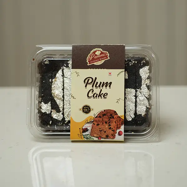 Rich and moist plum cake with egg from Pammi’s Bakers, topped with dried fruits and nuts – perfect for celebrations, gifting, or tea-time.