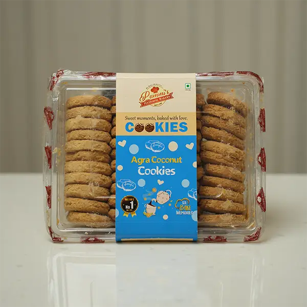 Golden-baked Agra Coconut Cookies with toasted coconut flakes from Pammi’s Bakers, arranged for serving.