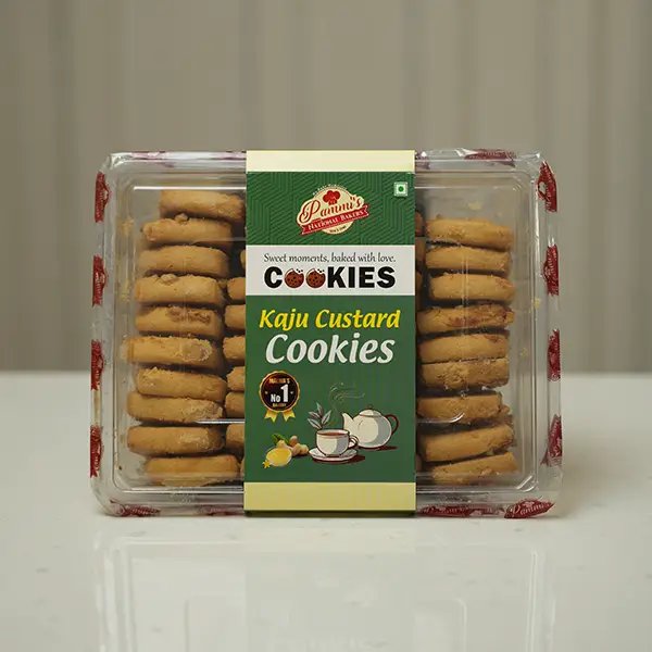 "Freshly baked Kaju Custard Cookies from Pammi’s Bakers with rich cashew topping and golden crust, perfect tea-time snack."
