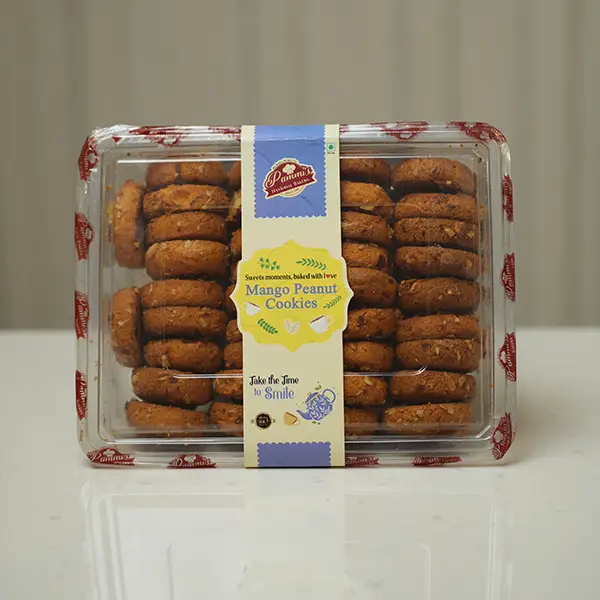 Freshly baked Mango Peanut Cookies from Pammi’s Bakers, made with roasted peanuts and real mango flavor – eggless and crispy tea-time treat.